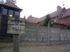 Lookout towers with barbed wire fence dividing Auschwitz in different sectors.
