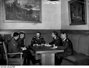 Himmler confers with Huber, Nebe, Heydrich and Müller.