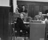 Priest testifies to the prosecution.