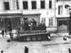 Civilians on the street are mounted on a Tiger I tank neutralized.