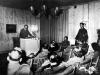Hitler surrounded by his staff in radio speech to the German people after the assassination attempt at Wolf's Lair.