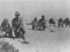British soldiers cleaning one of the mined camp before the troops could advance.