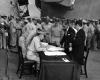 Lieutenant General Sutherland correcting Japanese surrender document.
