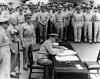 Nimitz signing Japanese surrender aboard USS Missouri.