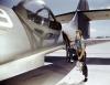 Jesse Rhodes Waller, a World War II Aviation Ordenanceman stationed at the Naval Air Station in Corpus Christi, Texas, installing a M1919 Browning machine gun in a US Navy PBY plane.