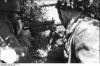 Two paratroopers camouflaged with M1919 Browning machine gun.