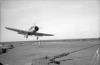 A Blackburn Skua landing on HMS Ark Royal carrier.