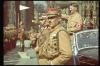 Hitler salutes German troops.