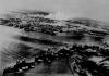 Captured Japanese photograph taken during the attack on Pearl Harbor. In the distance, the smoke rises from Hickam Field.