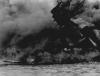 The USS Arizona burning after the Japanese attack on Pearl Harbor.