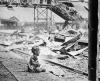 This terrified baby was one of the only human beings left alive in Shanghai South Station after the brutal Japanese bombing.