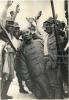 Japanese soldiers pose next to a bronze statue of Sun Yat-sen after capturing Shanghai.