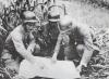 Officers of the Chinese 88th Division studying a map.