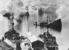 Ships burning in the harbor after air attack.