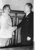 Joseph Stalin and the nazi minister of foreign affairs Ribbentrop, compliment each other during a meeting about the Poland division.
