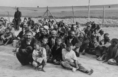 Gypsies arrivals in the Belzec labor camp await instructions.