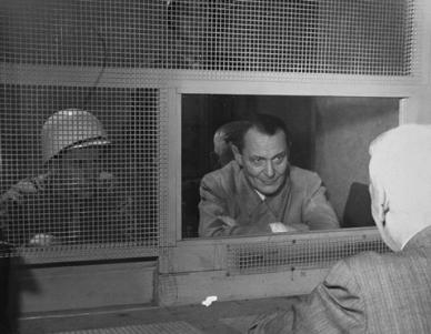 Hermann Goering speaking with his lawyer.