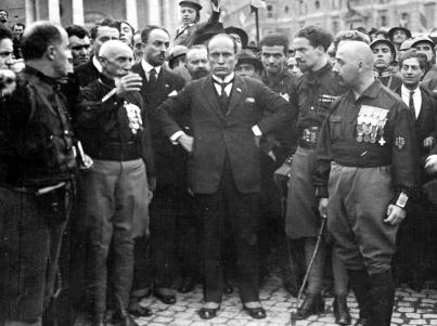 Benito Mussolini, center, hands on hips, with members of the fascist Party following their March on Rome.