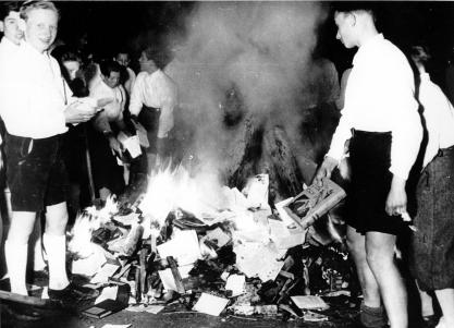 Members of the Hitler Youth participate in burning books.