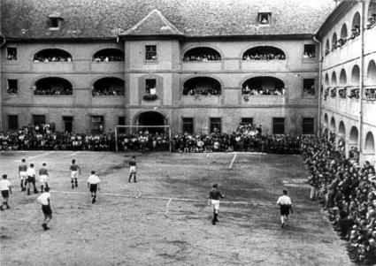A soccer match, taken from a propaganda film. 
