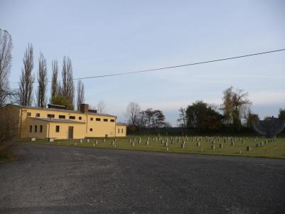 Menorah monument at Jewish Cemetery in Theresienstadt and with the crematorium in the left side.