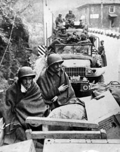 In a Dodge, the soldiers Isaltino Ribeiro da Silva and Eduardo Ramos de Oliveira cover themselves from the cold during the campaign of BEF, in Italy.