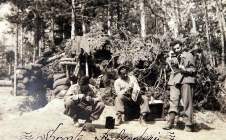 Sergeant Newton Lascalea (1st on the left) and Sergeant Gutenberg Melo (center) in front of a German bunker occupied by Brazilian FEB in front of Mount Belvedere.