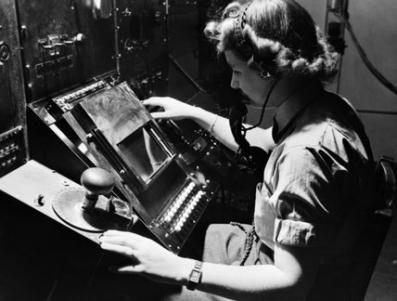 WAAF radar operator Denise Miley in the room at the  'Chain Home' receiver station.