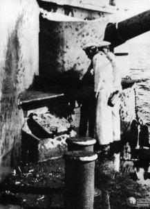 Sailors inspected damage on SMS Schleswig-Holstein caused by Polish coastal batteries of Hel Peninsula.