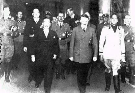 Emissary from Japan (on the left) and from Italy (on the right) accompanied by the german dictator Adolf Hitler after signing the Tripartite Pact.