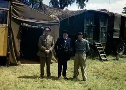 Sir Alan Brooke, Mr Winston Churchill and Sir Bernard Montgomery at Montgomery's mobile headquarters in Normandy.