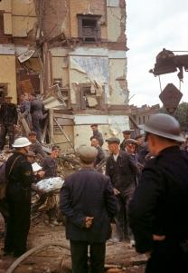 A London Civil Defense Rescue crew helps remove injured and dead civilians from destroyed buildings.