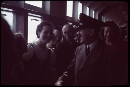 Adolf Hitler chats with several young women on a promenade of the German cruise ship Robert Ley, named after a prominant Nazi and head of the Labour Front, on its maiden voyage.