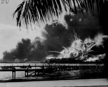 USS Shaw exploding during the Japanese raid on Pearl Harbor.