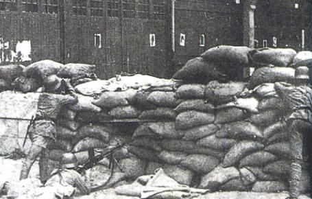 A section of a Chinese road blockade defended by the 87th Chinese Division in a street of Shanghai.
