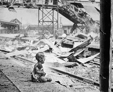 This terrified baby was one of the only human beings left alive in Shanghai South Station after the brutal Japanese bombing.